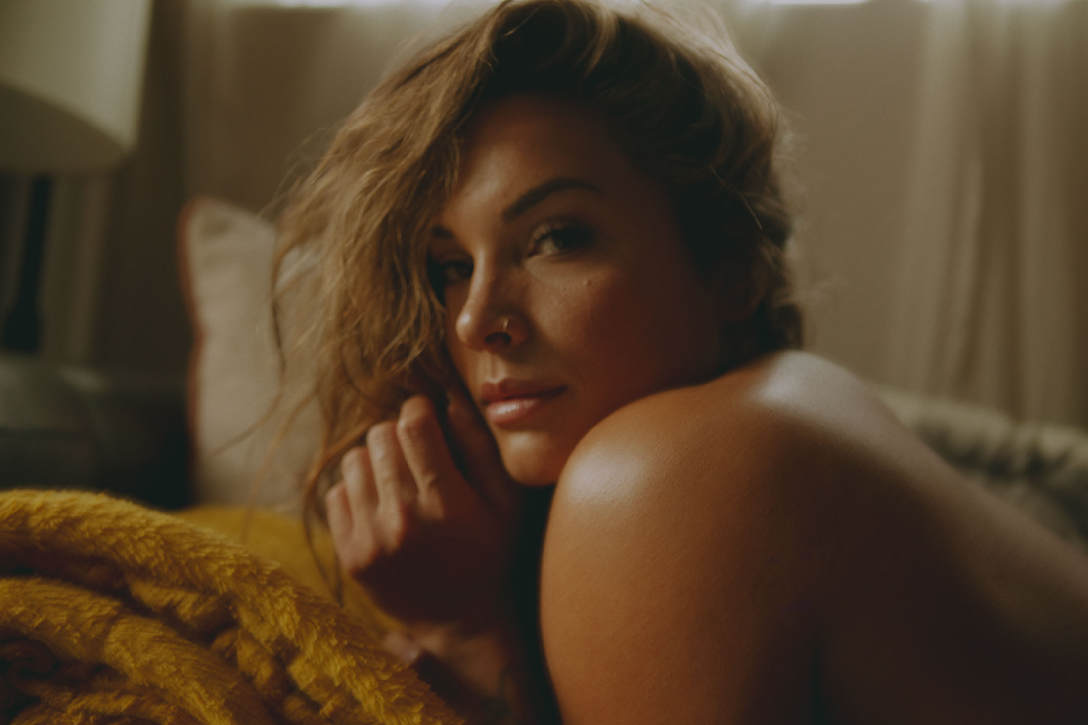 Close-up portrait of Apolonia Calleja highlighting her natural beauty, glowing skin, and confident expression