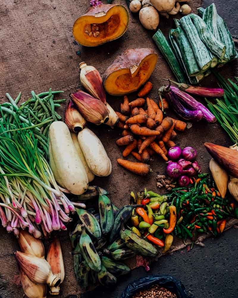 Colorful medley of fresh vegetables from Sri Lanka including carrots, peppers, and greens