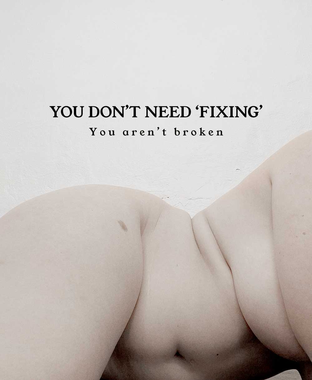 Artistic nude image of a plus size woman embracing her body with thick thighs and tummy