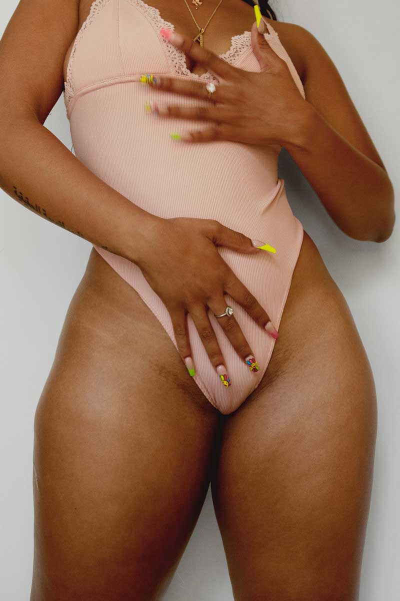 Portrait of a thick Black woman embracing her body’s natural proportions and the elegance of curves shaped by nature’s Golden Ratio.