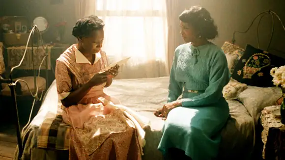 Scene from The Color Purple depicting Celie, a young Black girl facing hardship and growth over 30 years after a traumatic early life in the early 1900s American South.