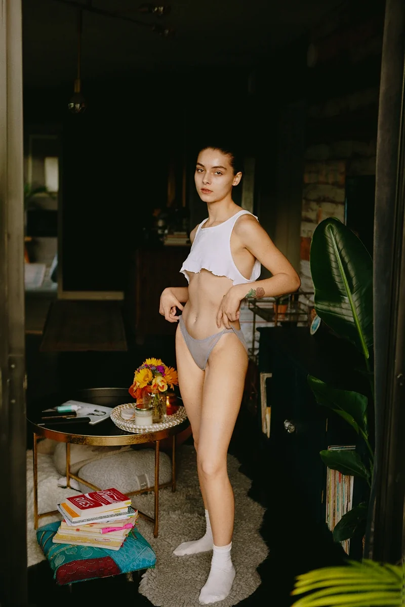 Angelina Love in soft natural light, relaxed and confident in her own space