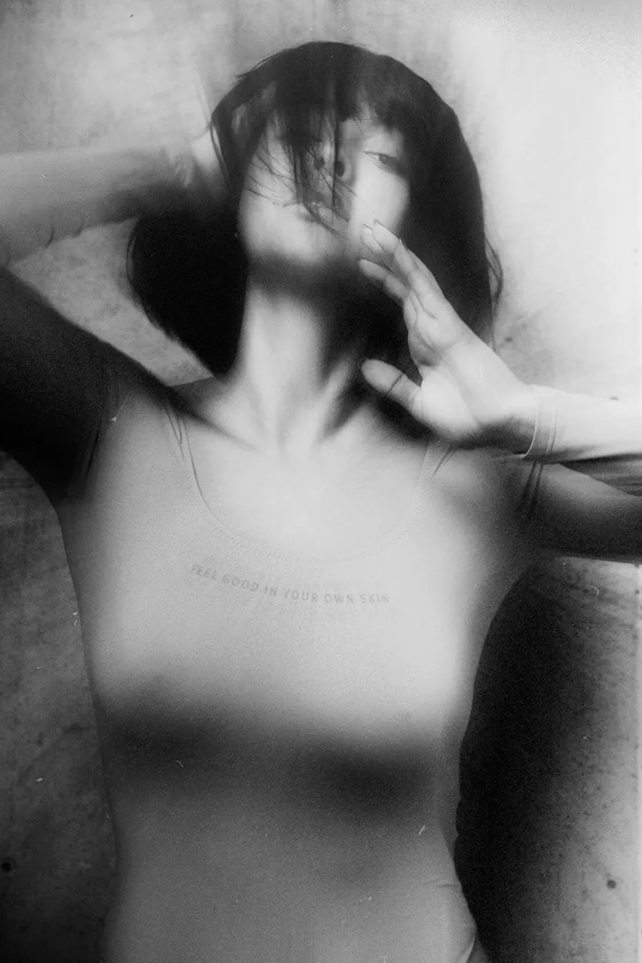 Black and white portrait of Irene Noren captured in motion, using intentional blur to convey introspection and presence