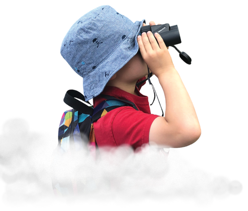 Little boy in a floppy hat using binoculars, as if in a cloud in the sky.