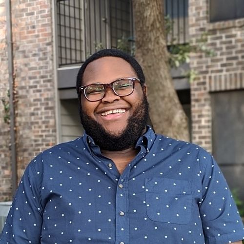 A headshot of Kipaya Kapiga