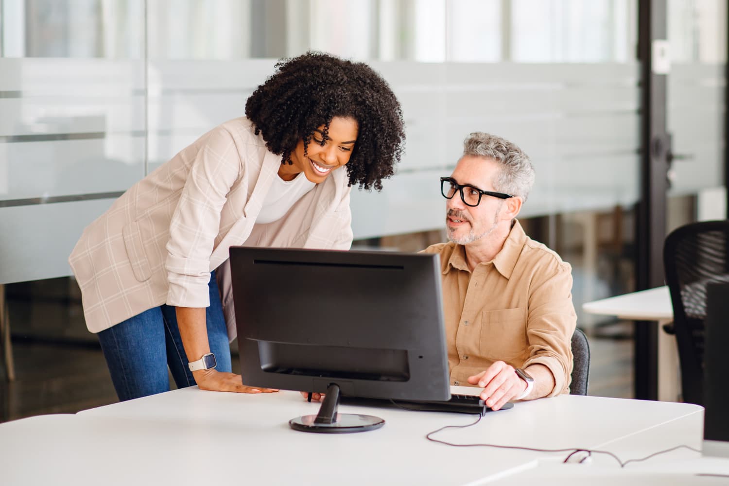 Insurance professionals collaborating over digital interface