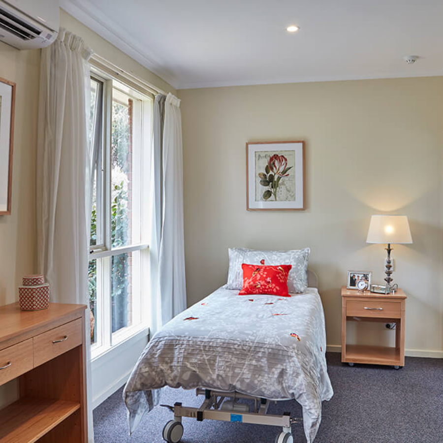 Bright resident bedroom at Greenwood Manor retirement home near Braeside, designed for comfort and independence.