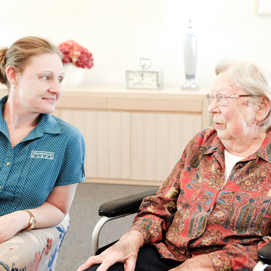 Supportive staff-and-resident moment at Greenwood Manor, a nursing home in Bangholme with compassionate care services.