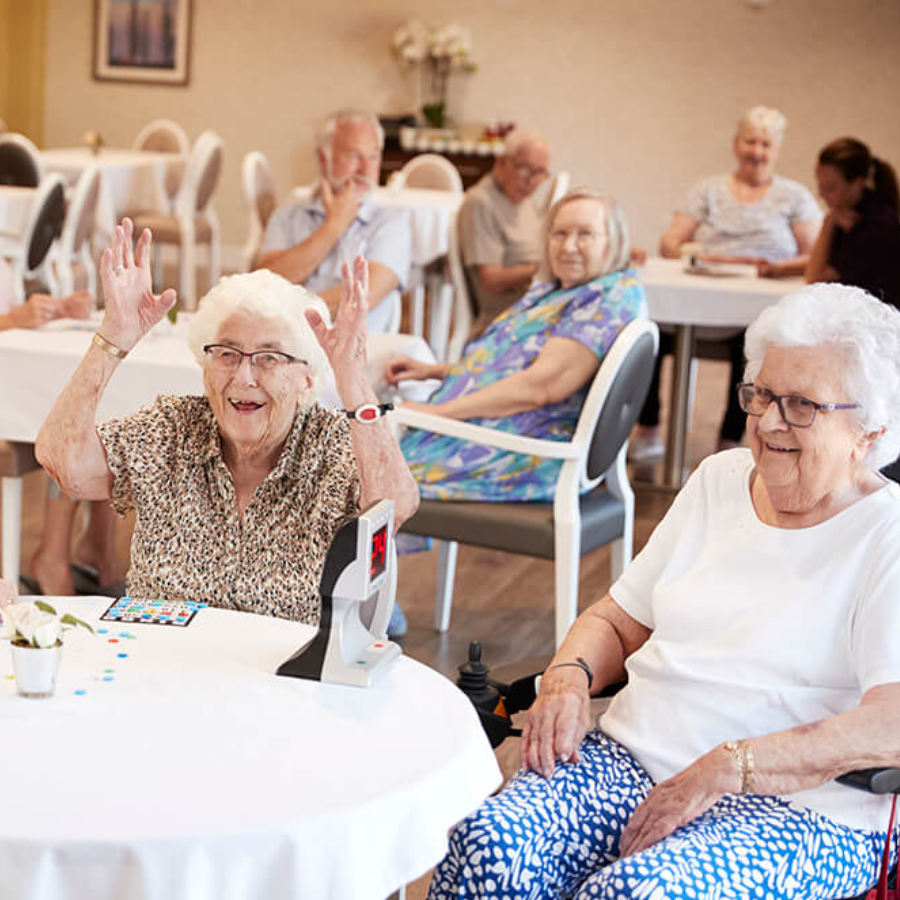 Aged care Moorabbin residents enjoying bingo, fostering social connection, joy, and stimulation.