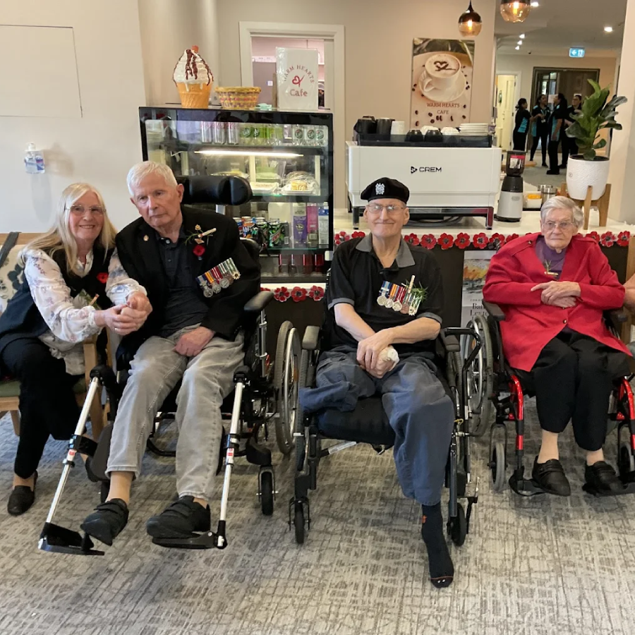 Residents at a Hampton Park aged care facility enjoying a community remembrance event with staff, showing care, respect and connection.