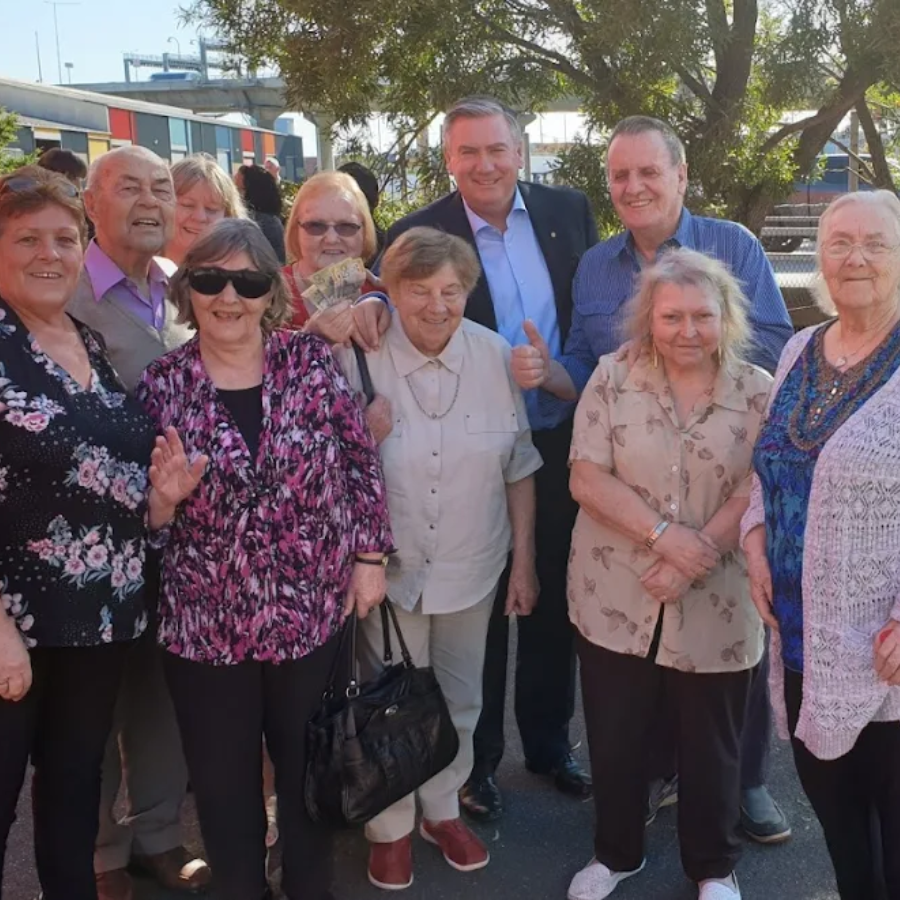 Residents and visitors gathering outside a Hampton Park nursing home, celebrating friendship and community spirit.