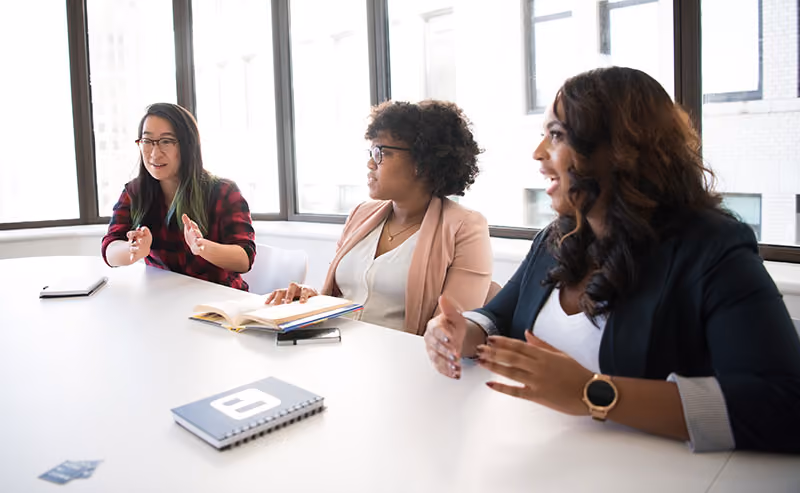 Alt tag: Recruitment and hiring team assessing hiring process for DEI.