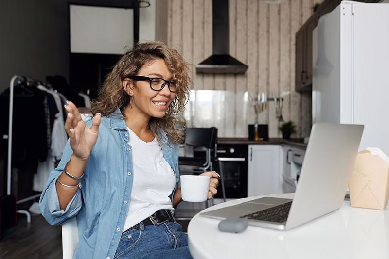 A manager thanking a remote employee during a one-on-one video call.