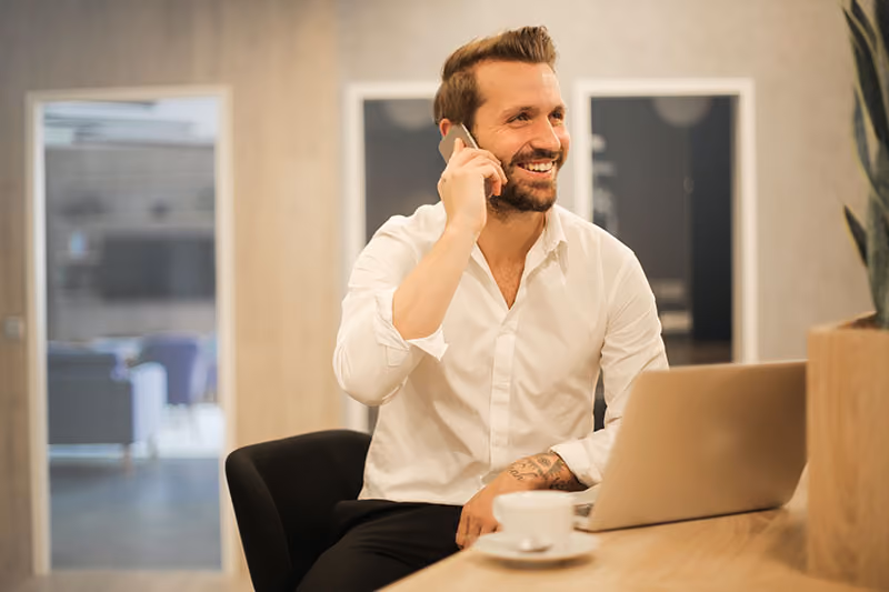 Manager phoning an employee to give them recognition.