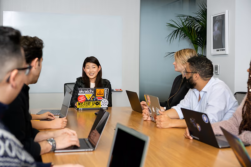 An HR team holding a discussion about the company’s new hybrid work policy.