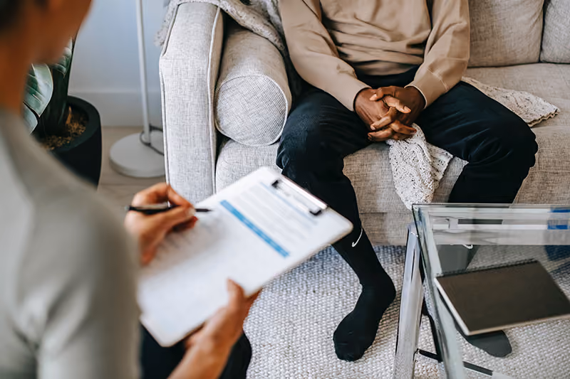 A manager giving employee feedback using a performance review template.