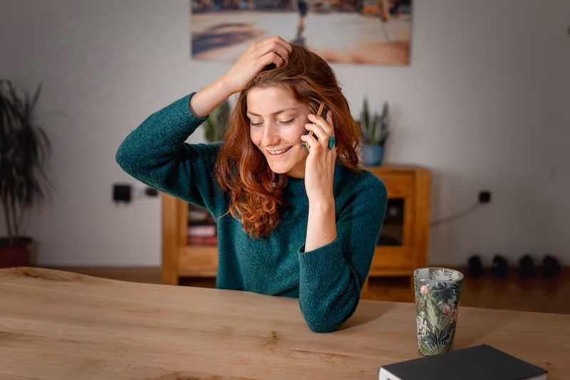 A job candidate answering pre-screening interview questions via a phone interview.