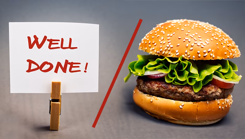 A note that says well done compared to a hamburger as a means of giving employee recognition and rewards.
