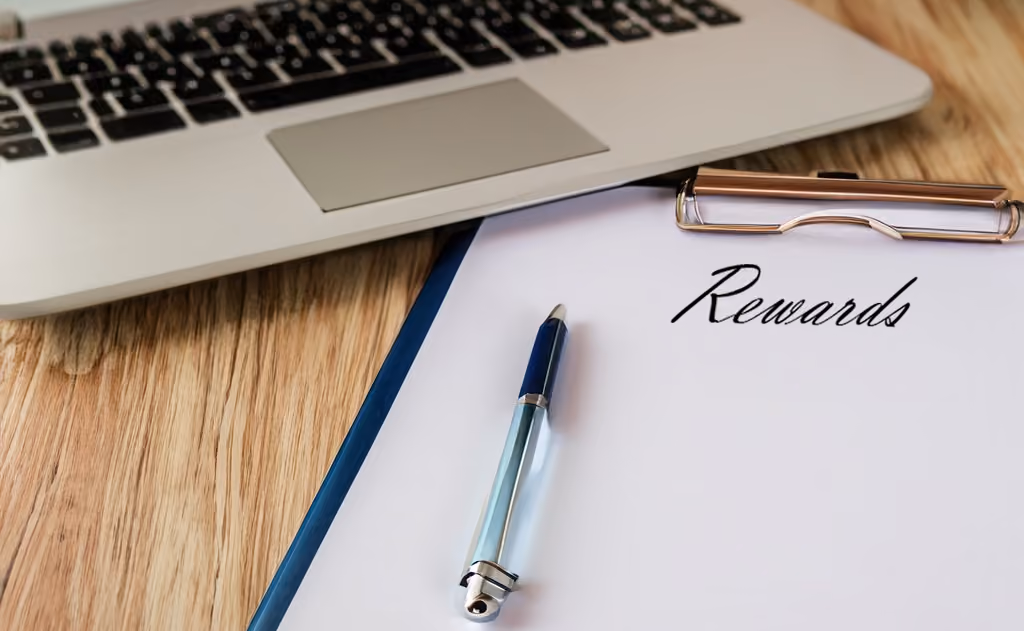 Employee rewards program planning document on a desk