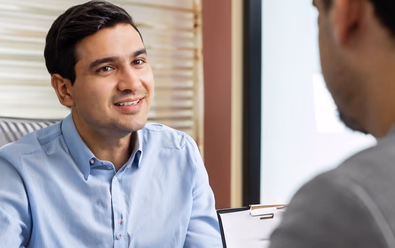Interviewer using active listening techniques during a job interview.