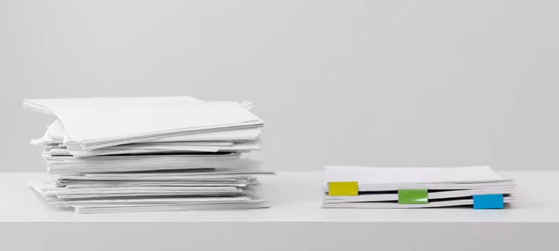 A pile of organizer HR cover letters on a desk.