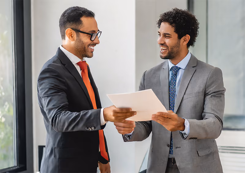 A top-performing employee receives a notification of their performance bonus from their manager