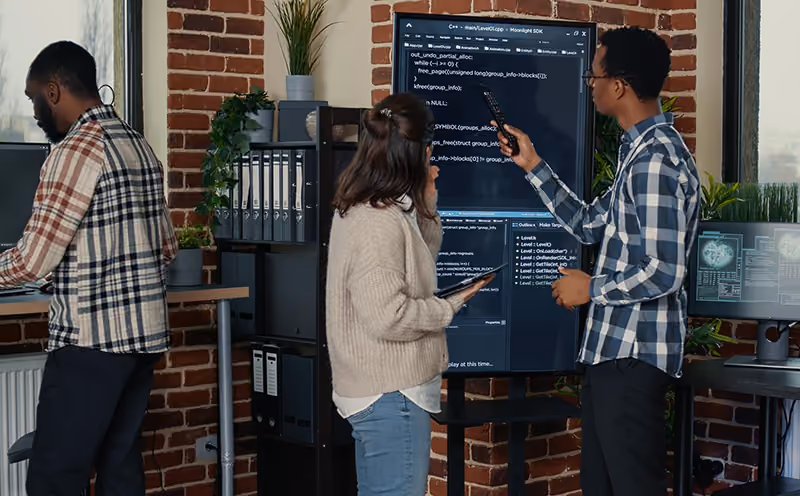 HR professionals reviewing people analytics captured by their AI tools.