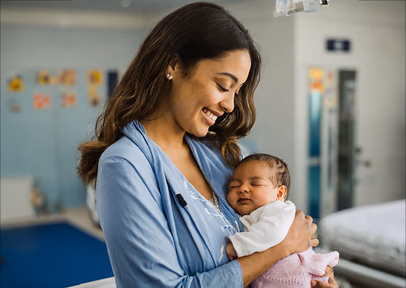 An employee taking paid parental leave to care for her newborn baby.