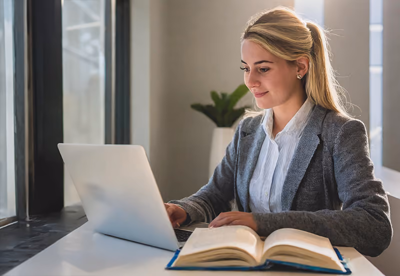 A young professional works on obtaining an HR certification through an online course.