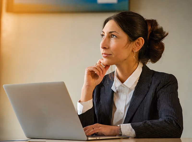 An HR professional contemplating the best way to answer a technical question during a one-way video interview.
