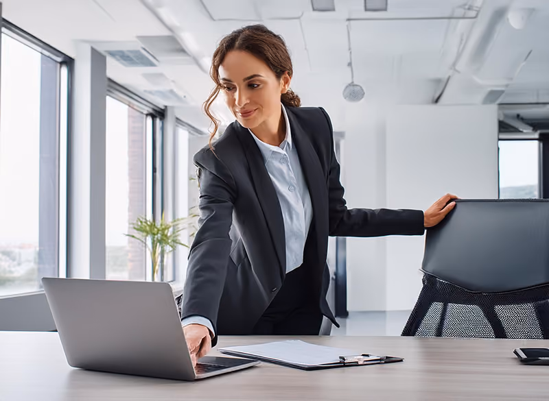 An HR professional checking up on KPIs of a newly implemented HR software.