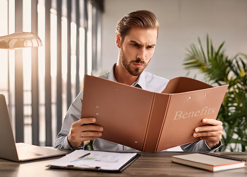 An HR leader reviewing the company’s employee benefits package.