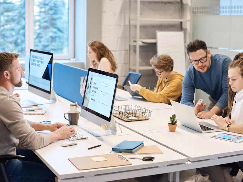 A team of professionals working on their computers.