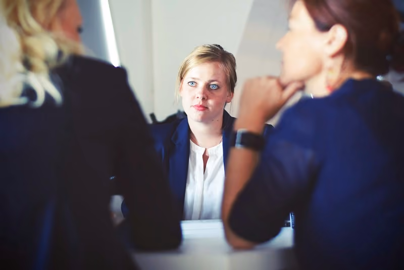 a female candidate participating in a corporate job interview