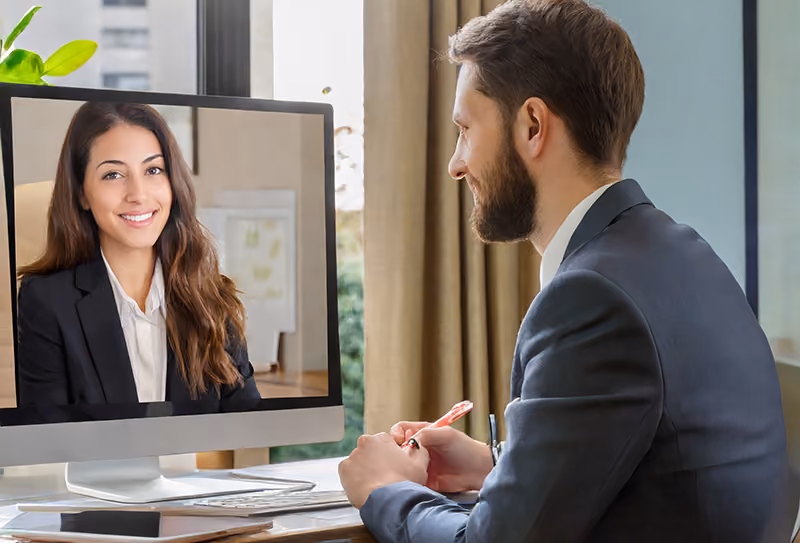 An hiring manager conducting a video interview with a job candidate that was scheduled using recruitment automation.