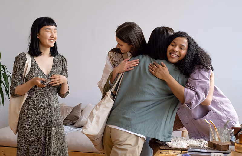 An example of positive feedback is a team thanking their manager for compassionate leadership with a group hug