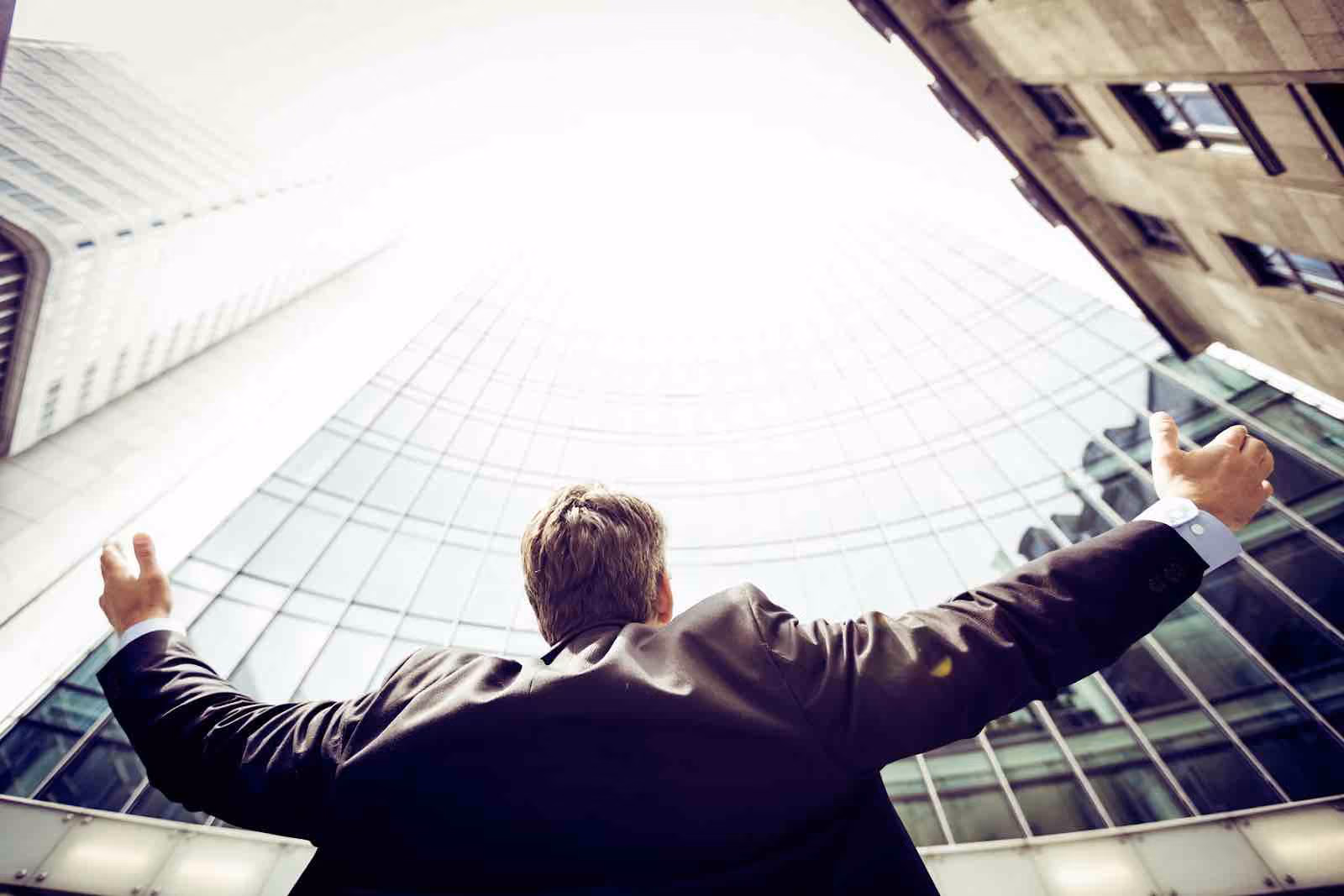 An-employee-opening-arms-out-of-excitement-for-being-awarded-for-their-performance