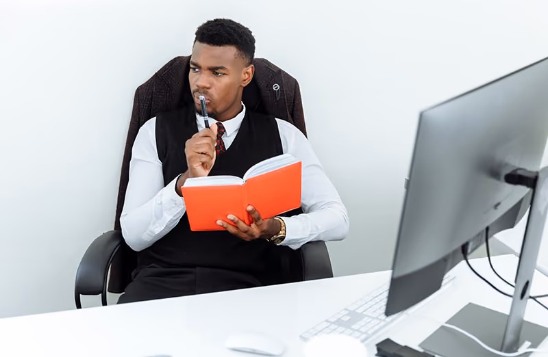 A-manager-recording-personal-goals-and-successes-in-this-journal-as-a-means-of -self-recognition