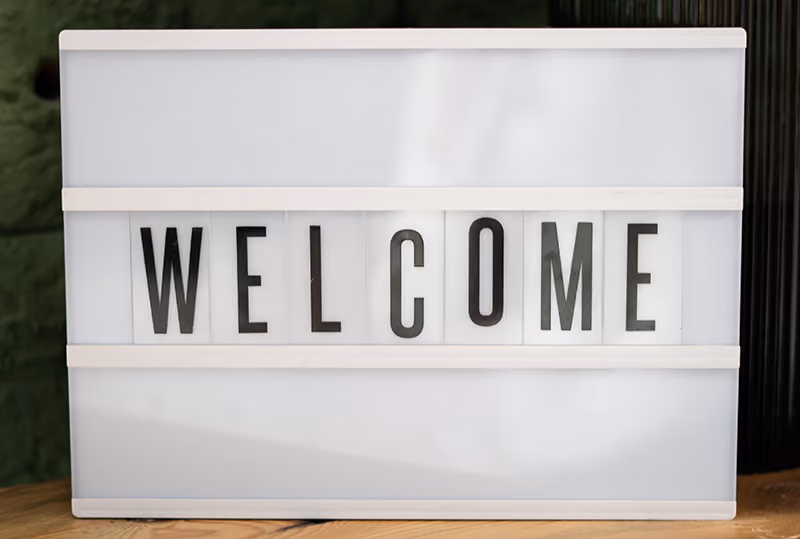 A sign to welcome new employees to their office