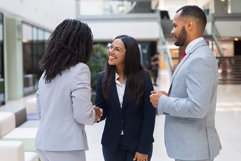 Welcoming a new hire during onboarding.