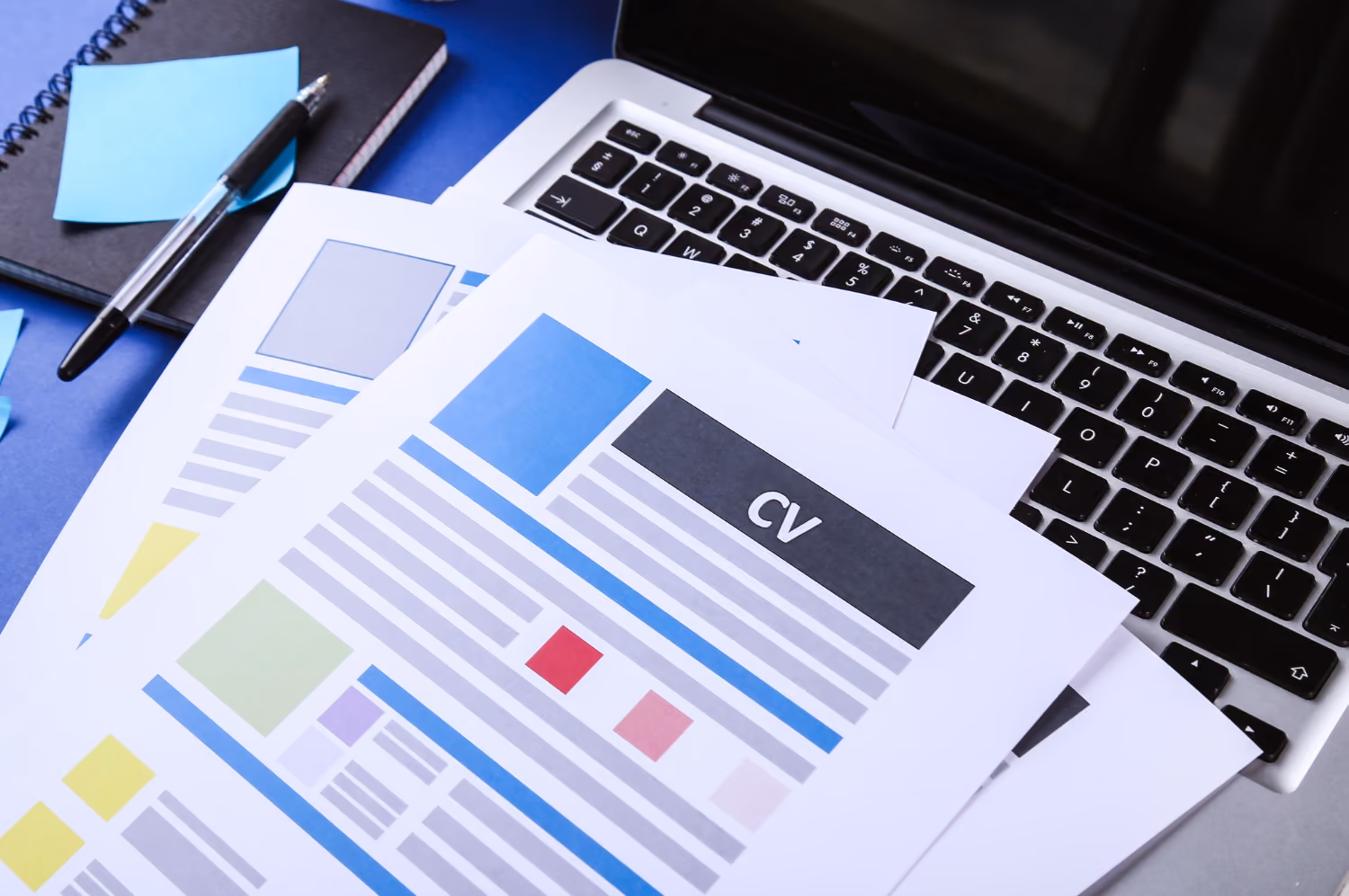 A resume template on top of a laptop.