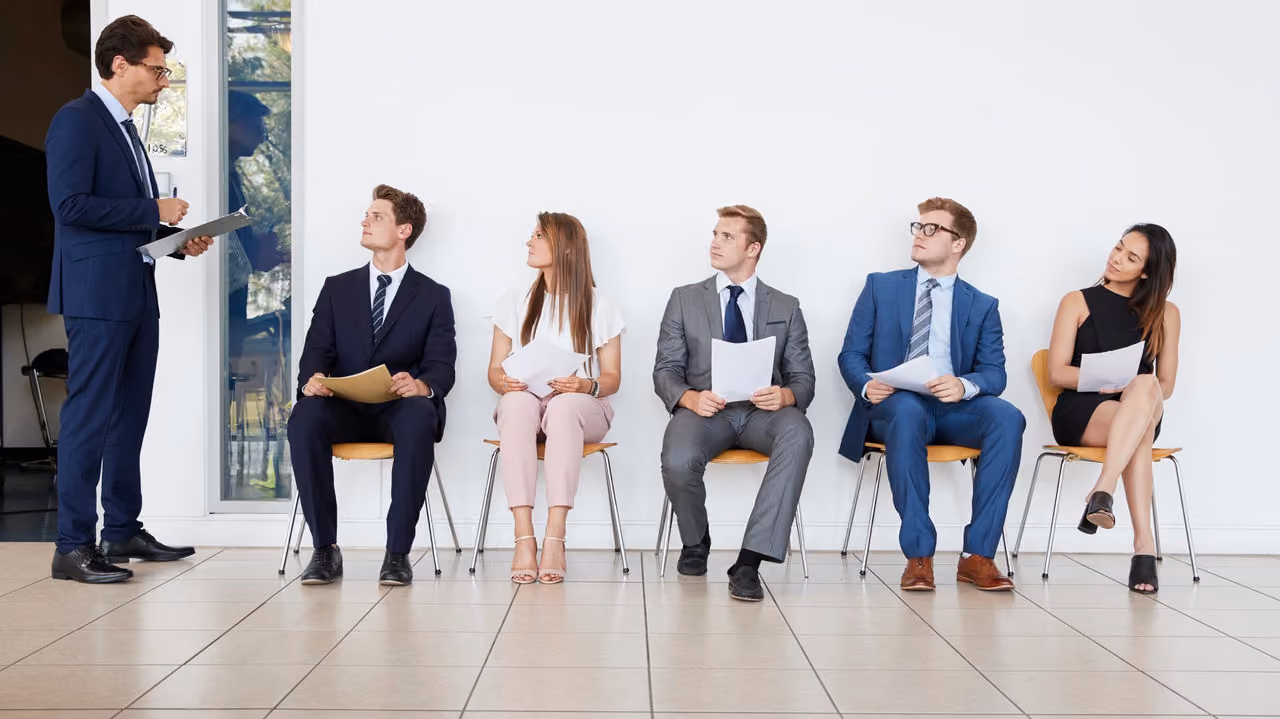 A hiring manager assessing candidates in job interviews
