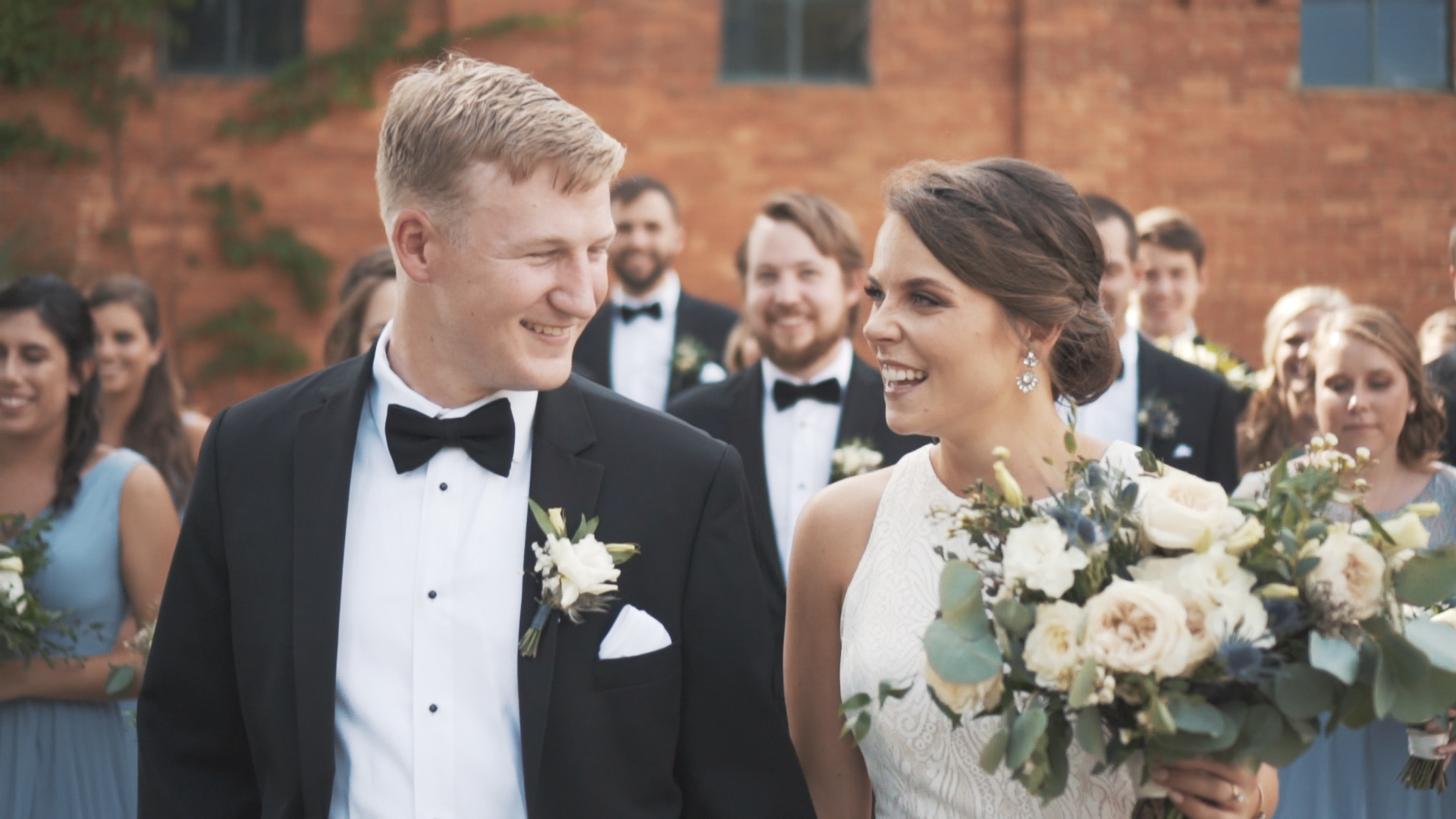 Beautiful bride and groom under umbrella on wedding day - minimalist, artsy shot.