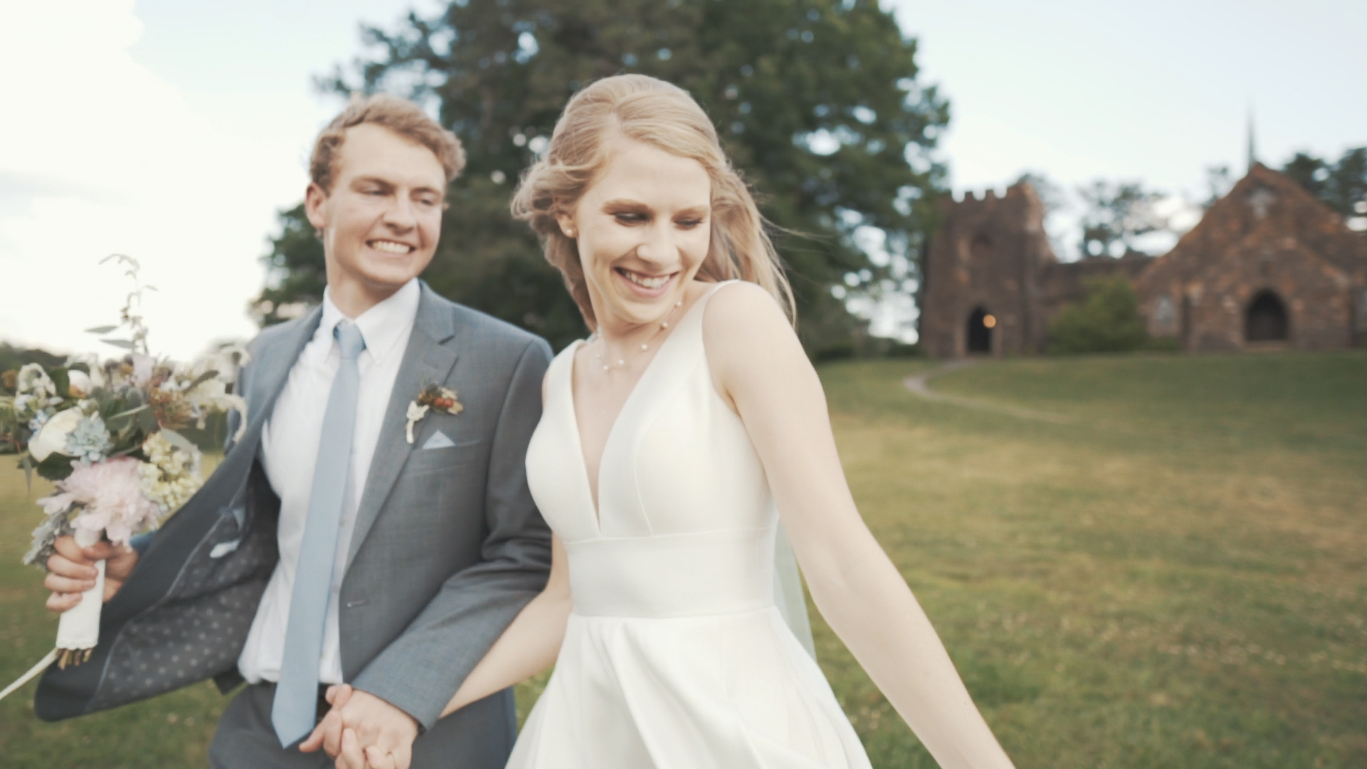 Beautiful bride and groom under umbrella on wedding day - minimalist, artsy shot.
