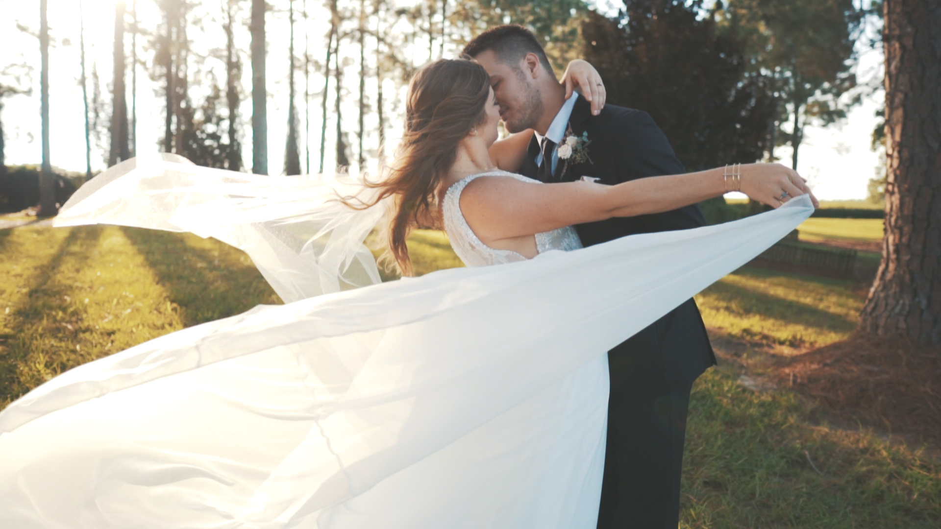 Beautiful bride and groom under umbrella on wedding day - minimalist, artsy shot.