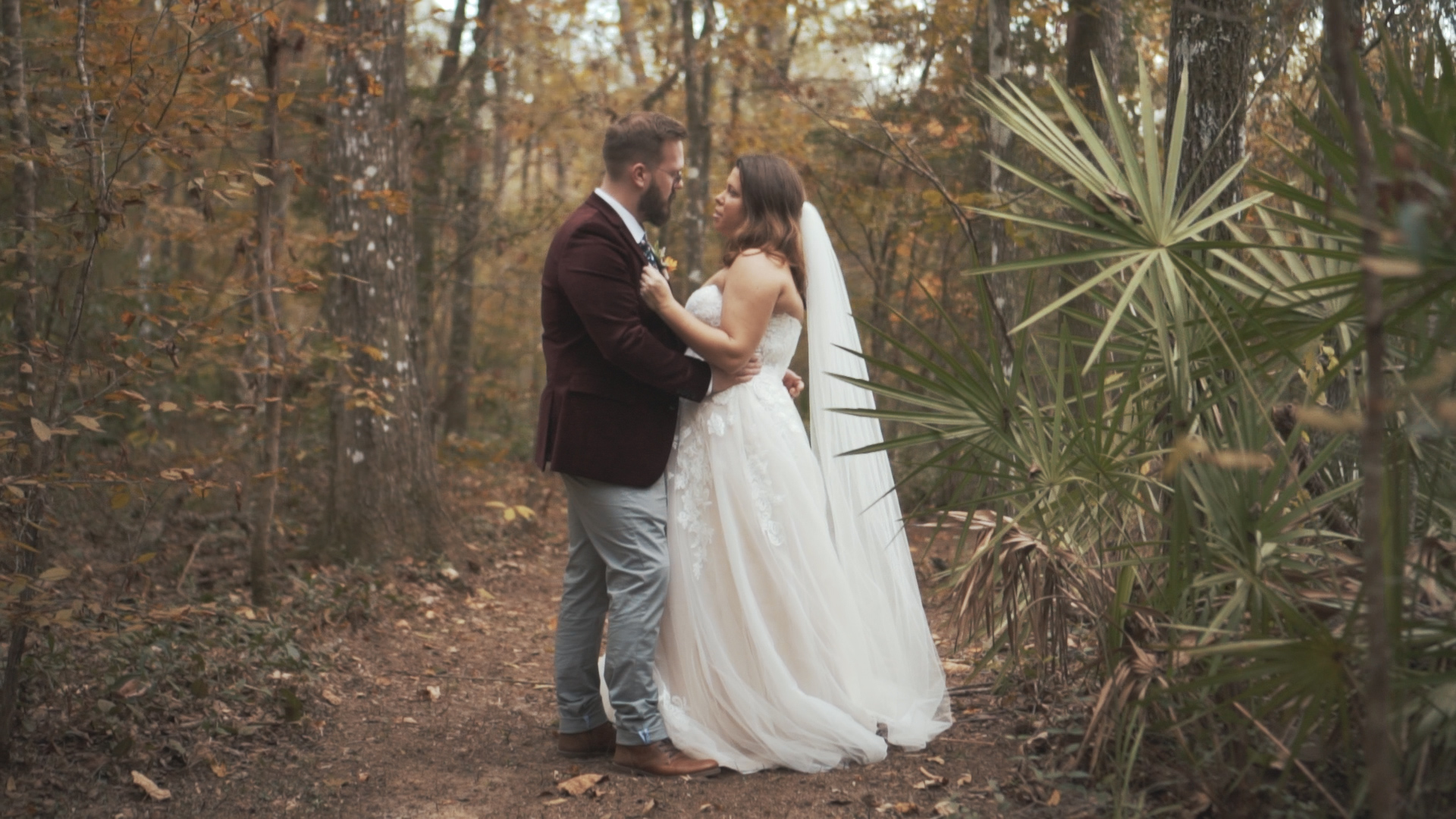 Beautiful bride and groom under umbrella on wedding day - minimalist, artsy shot.