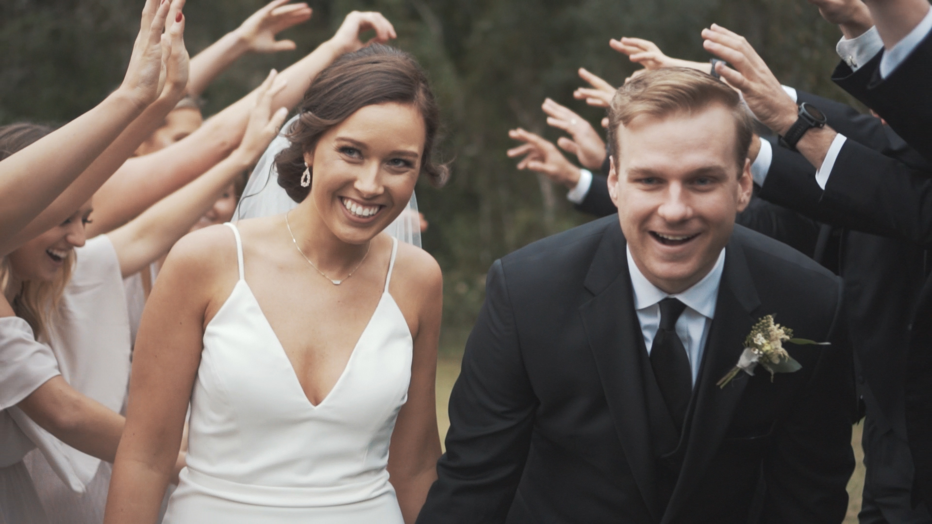 Beautiful bride and groom under umbrella on wedding day - minimalist, artsy shot.