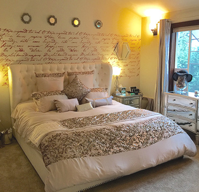 Master bedroom with french love poem stenciled on the wall