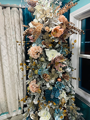 Designer Floral Christmas tree with teal, gold, blush colored ornaments