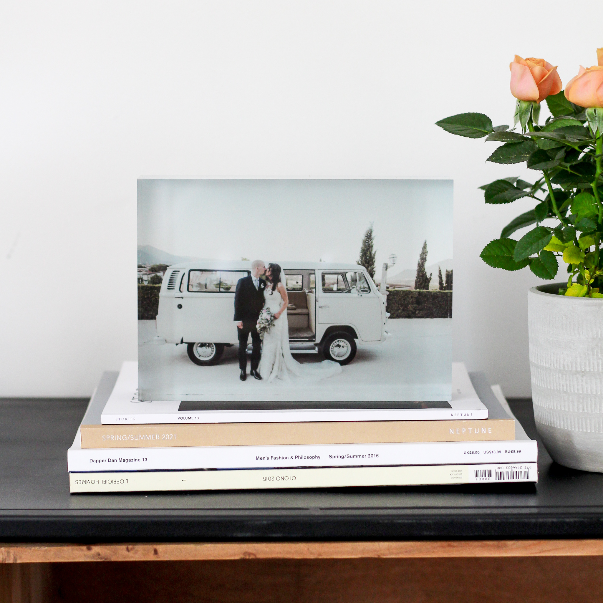 Acrylic photo block on stack of books on sideboard